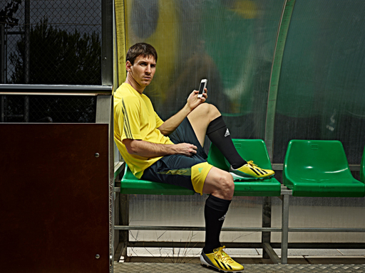 Lionel Messi playing with the adizero f50 mobile app Lionel Messi playing with the adizero f50 mobile app