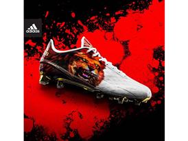 lion adidas cleats