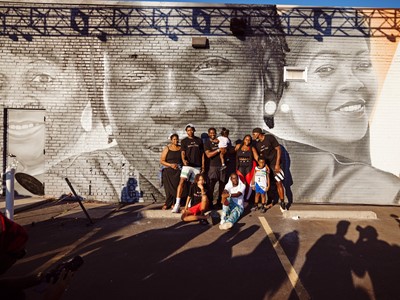 Anthony Edwards with his Mural commemorating the Anthony Edwards 1 in Oakland City Atlanta