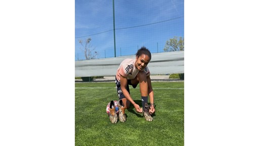 wendie-renard-spotted-in-the-wales-bonner-predator--featuring-a-snake-print-upper-with-dark-brown-de
