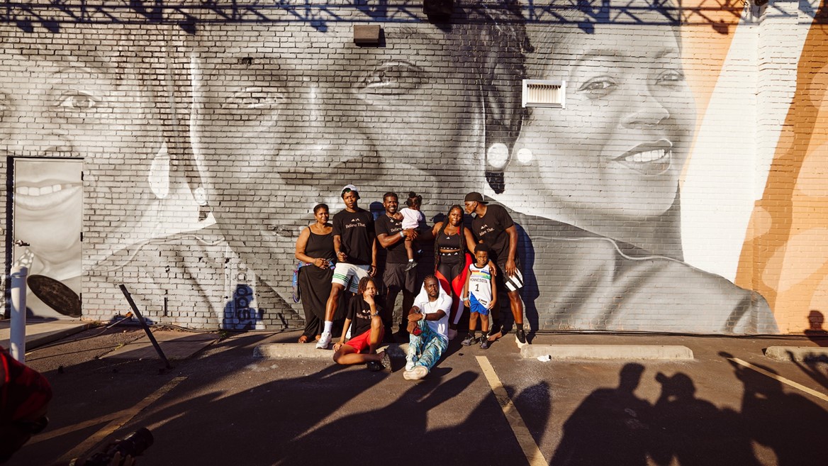Anthony Edwards with his Mural commemorating the Anthony Edwards 1 in Oakland City Atlanta