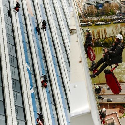 Technicians working hard to display the colours of Paris 2024 on Neptune Tower