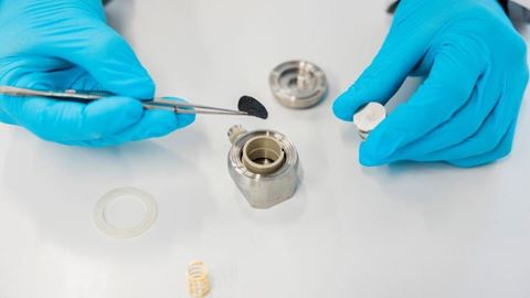 Theion scientist assembles a coin cell