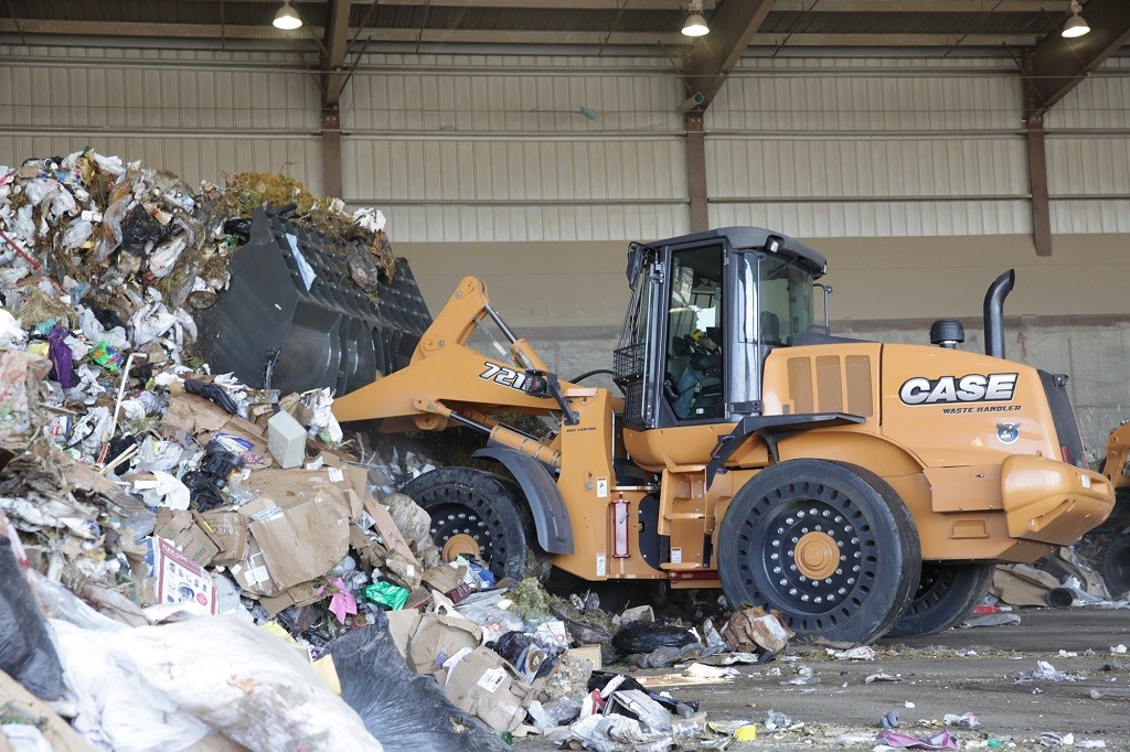 Case 721F wheel loader working at a waste management facility