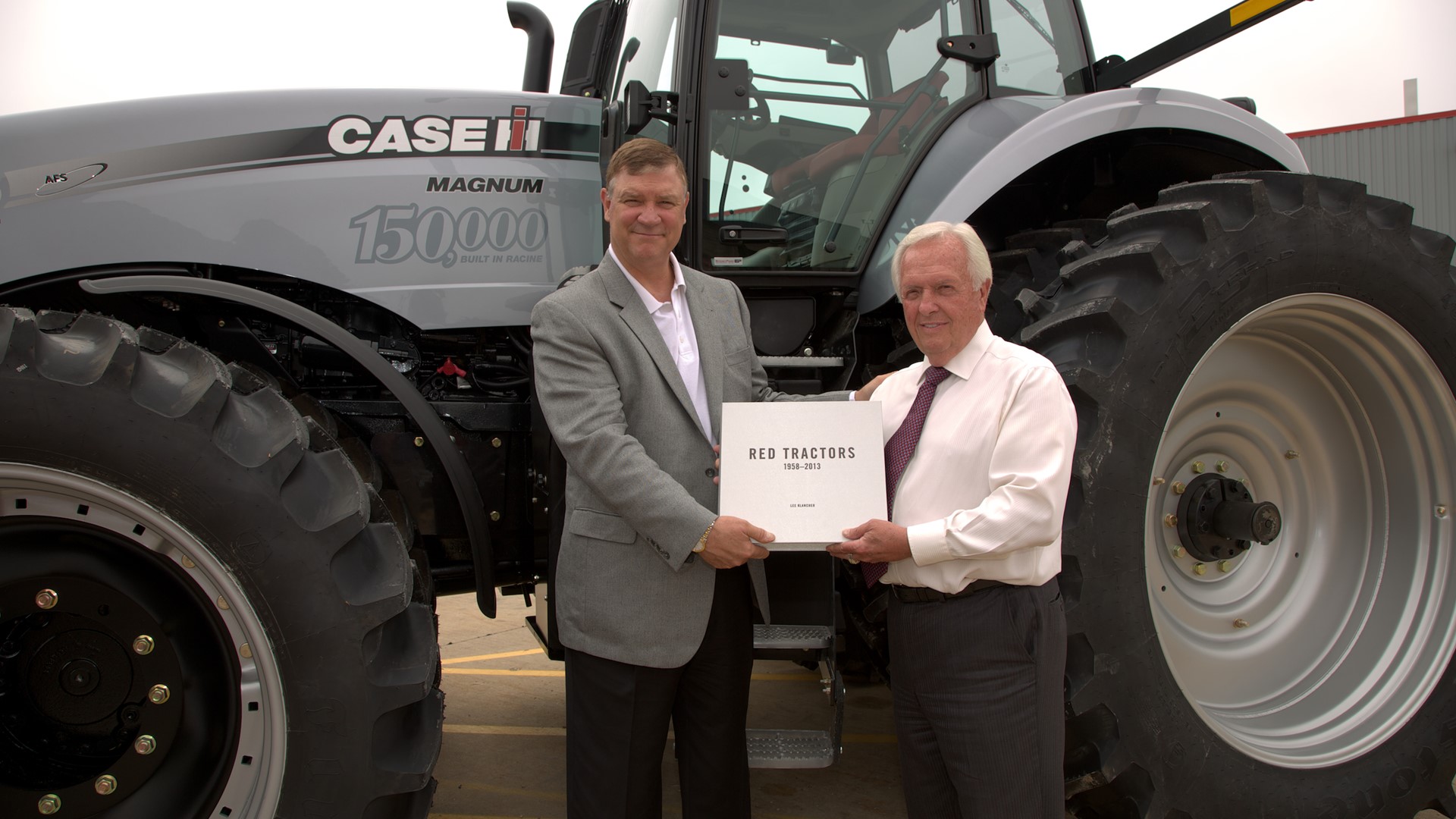 Jim Walker, Vice President, Case IH NAFTA, presents Gerry Forsythe with the 150,000th Magnum tractor