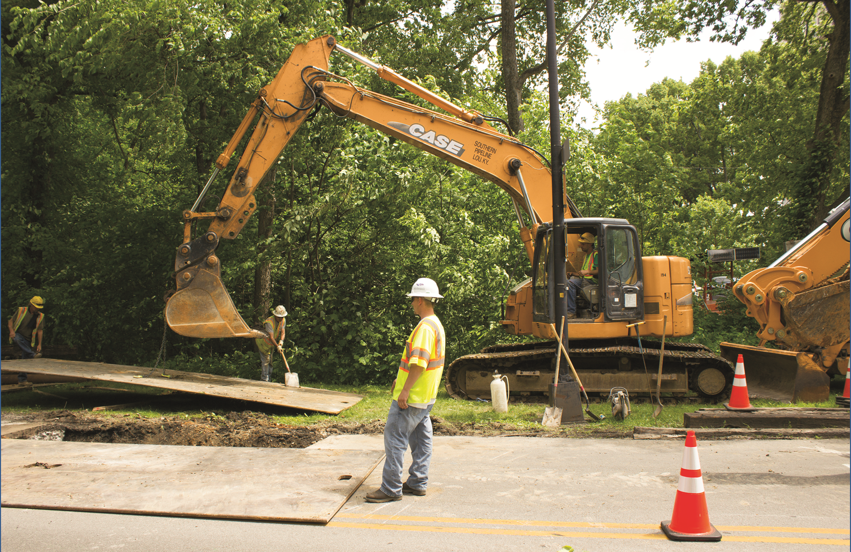 Southern Pipeline crews work on a roadside utility project in Louisville, Kentucky