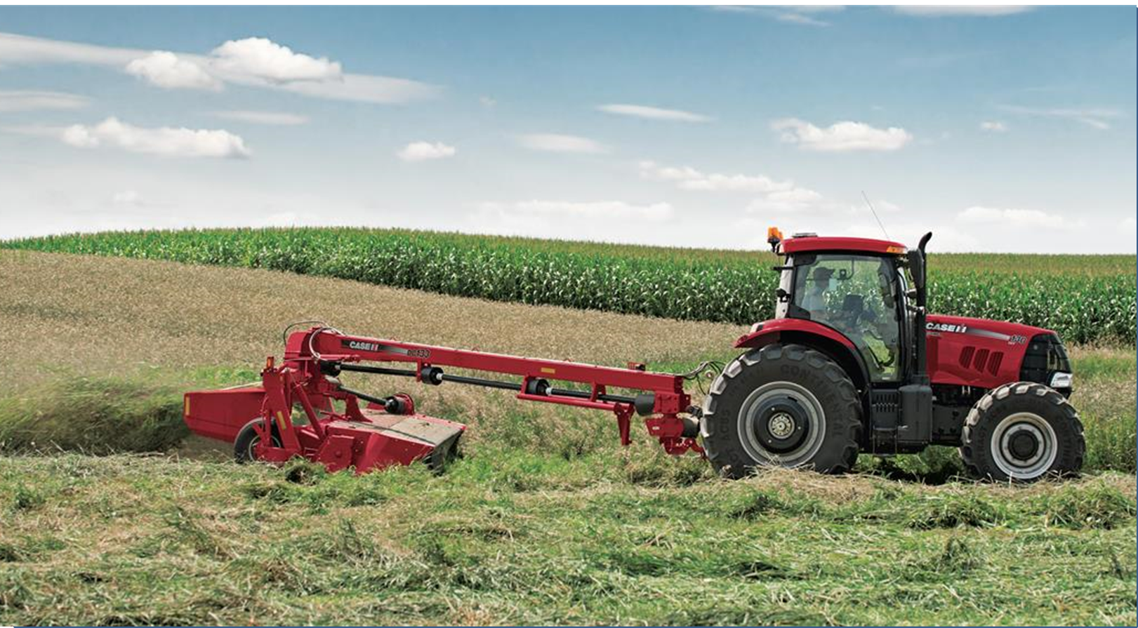 Puma Tractor with a Disc Mower Conditioner at work