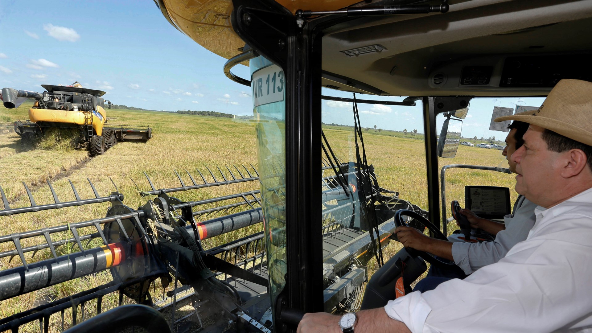 The President of Paraguay in the cab of a New Holland combine harvester,  photo courtesy of René González