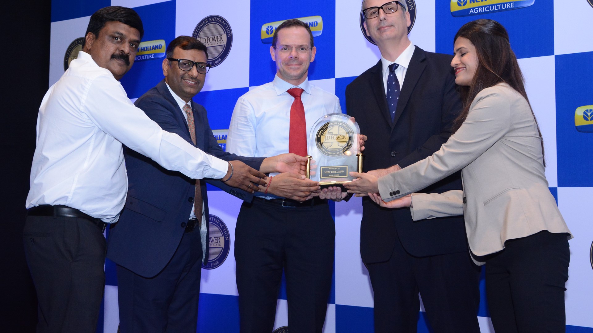 Senthil Kumar, Bimal Kumar and Gabriele Lucano receiving an award from J.D. Power Officials