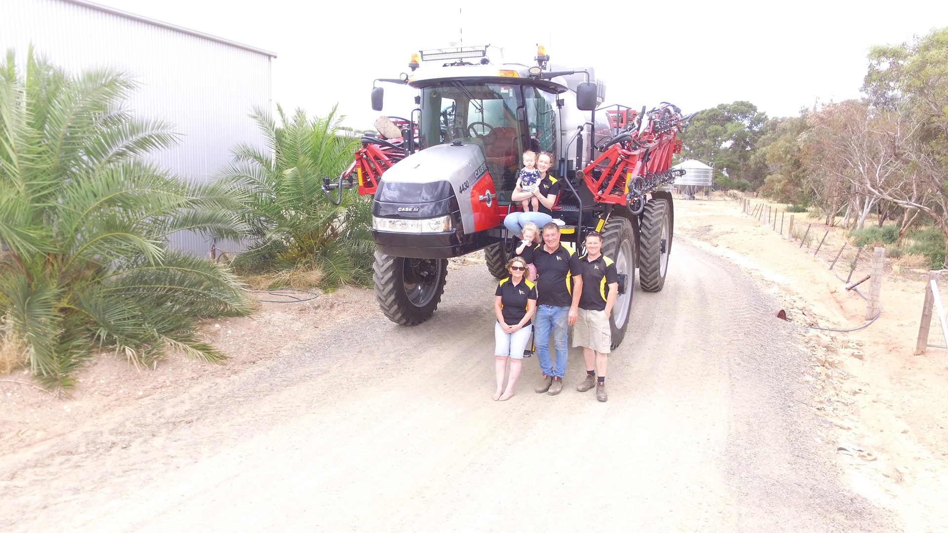 The Krieg family with their hardworking, special anniversary Patriot sprayer.