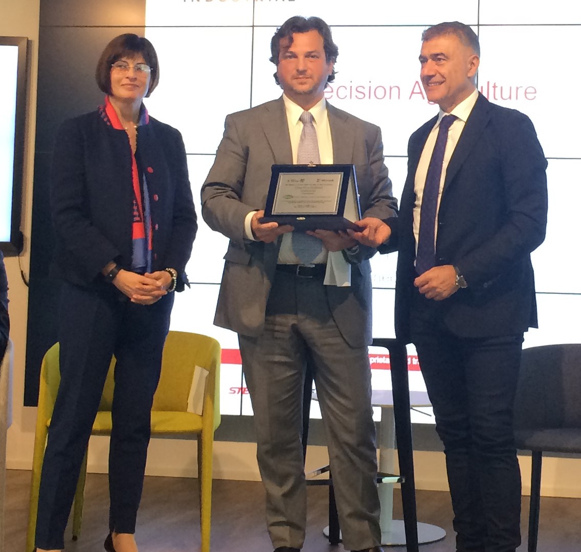 Antonio Marzia, Head of Connected Services at CNH Industrial collecting the “Green Pride of Innovation" award
