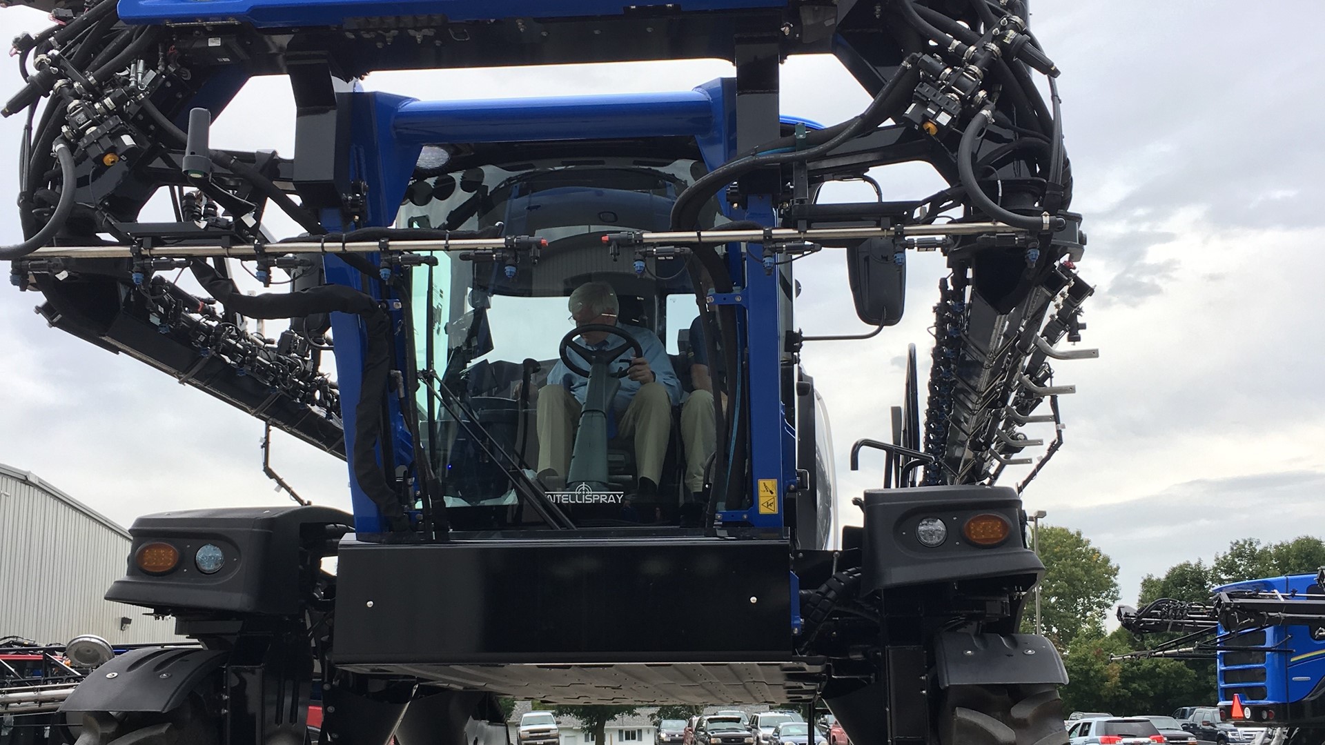U.S. Representative Glenn Grothman sits in cab of a crop sprayer at CNH Industrial's New Holland Agriculture plant