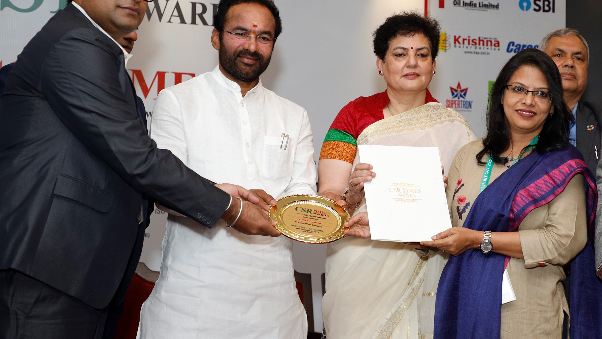 Mr. G. Kishan Reddy, Minister of State for Home Affairs (at center) presents CSR Times Award to CNH Industrial