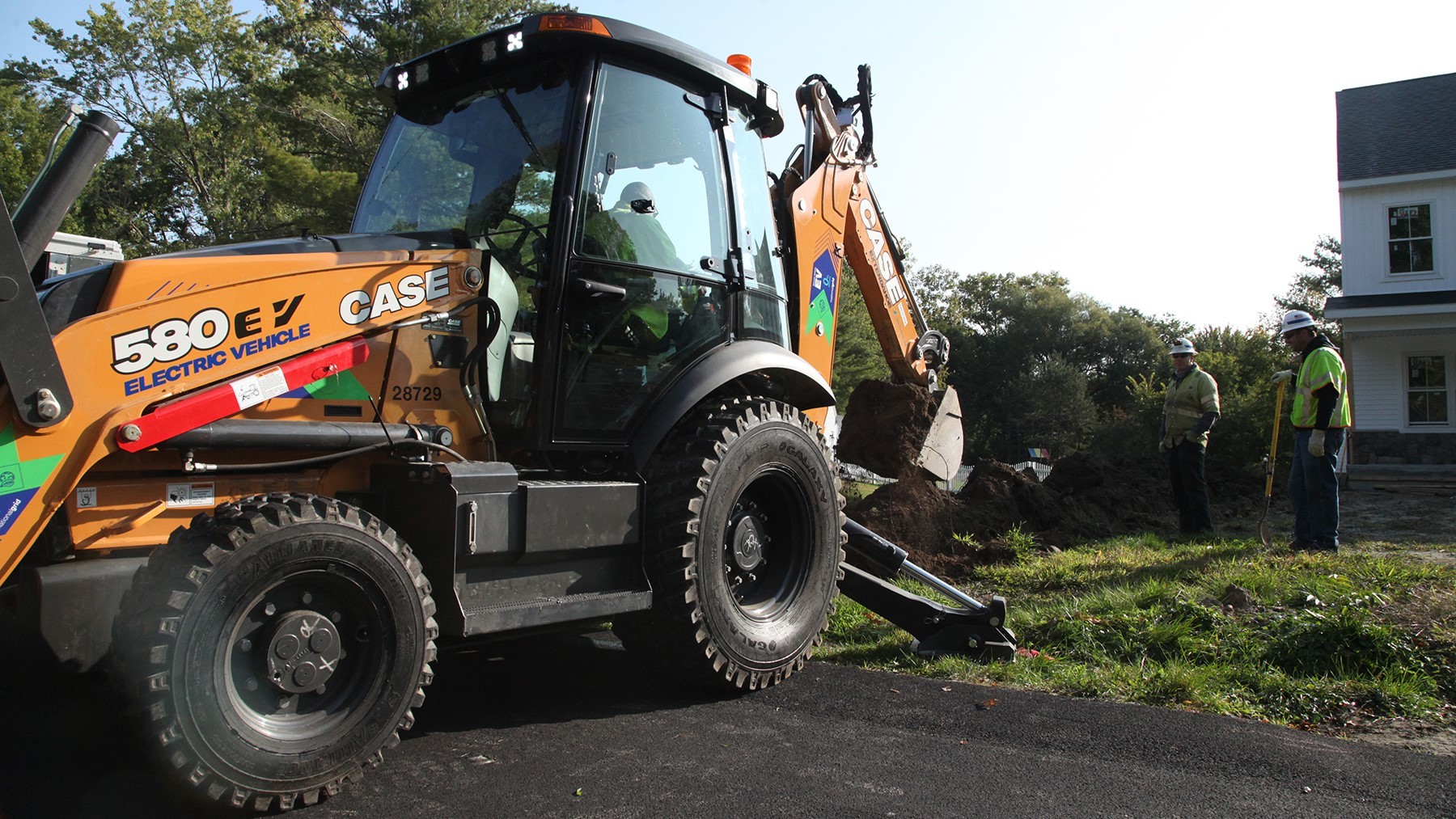 National Grid crews work with the CASE 580 EV
