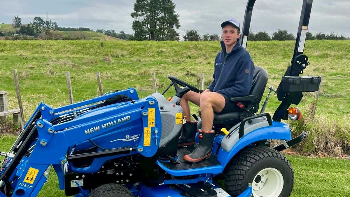 Hugh Jackson presented with New Holland Boomer 25C prize at Roger Gill Agriculture in Huntly