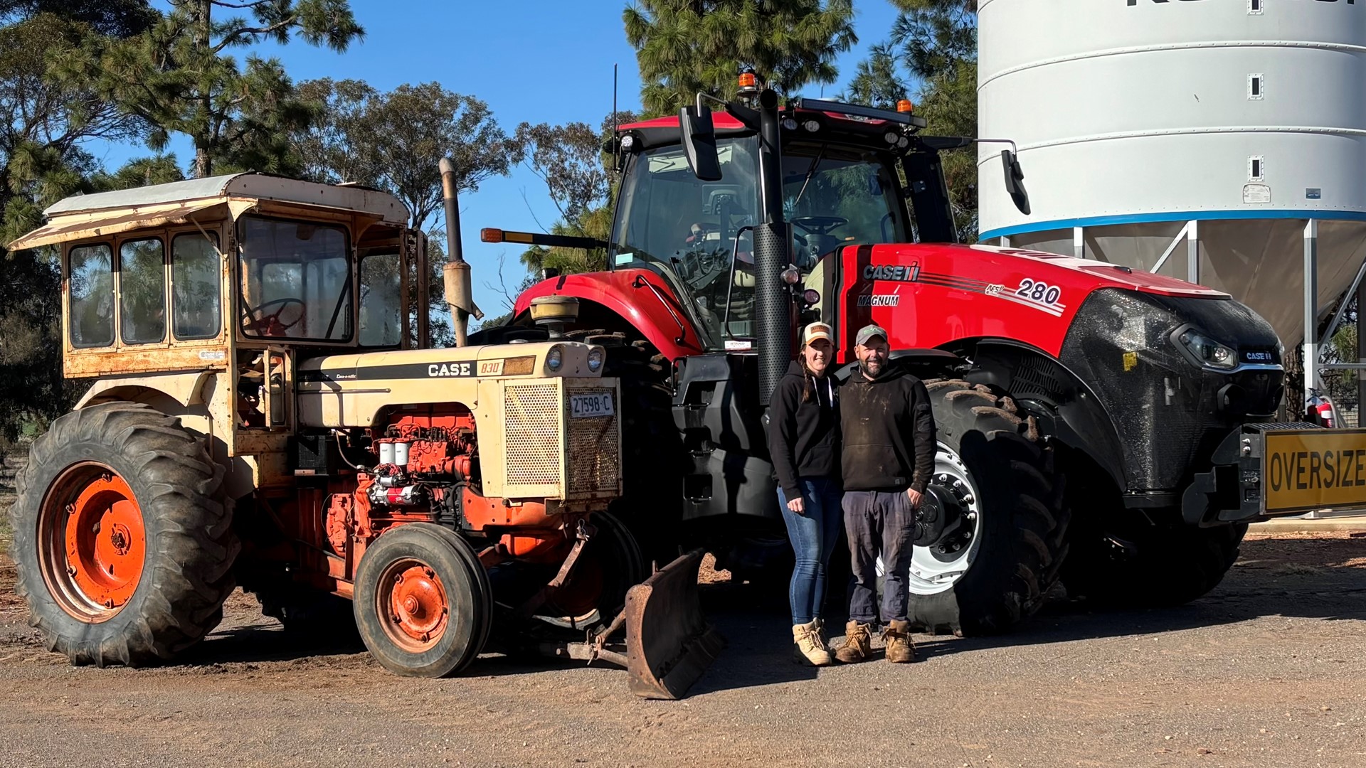 Ben and Melanie McLellan with their current Case IH Magnum tractor and the 1970s Case 830