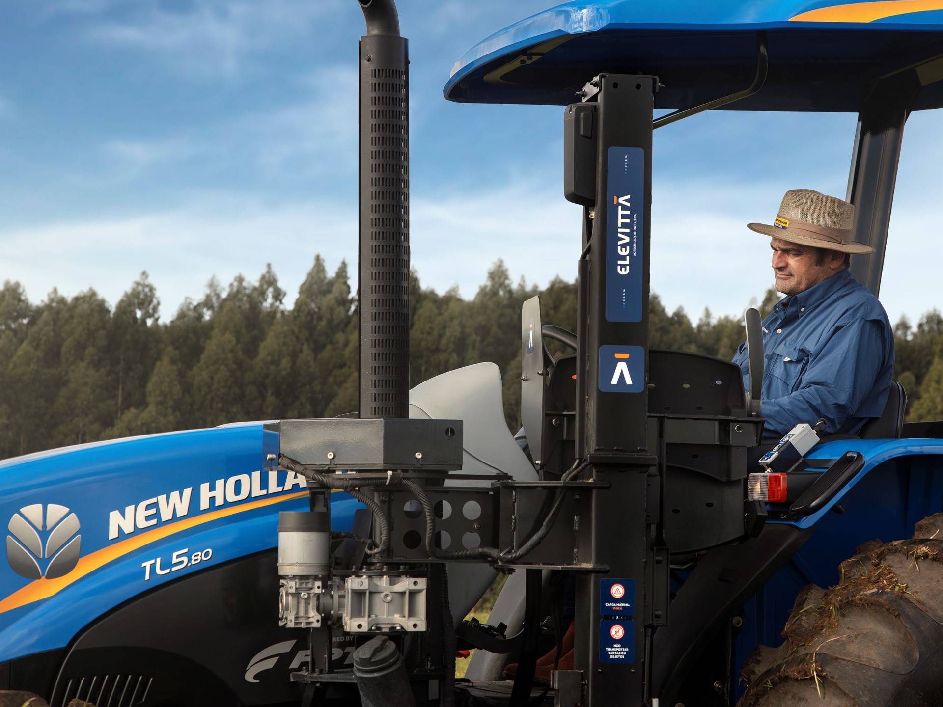 Farmer Fernando Dalmolin operating the accessible tractor mobile armchair device