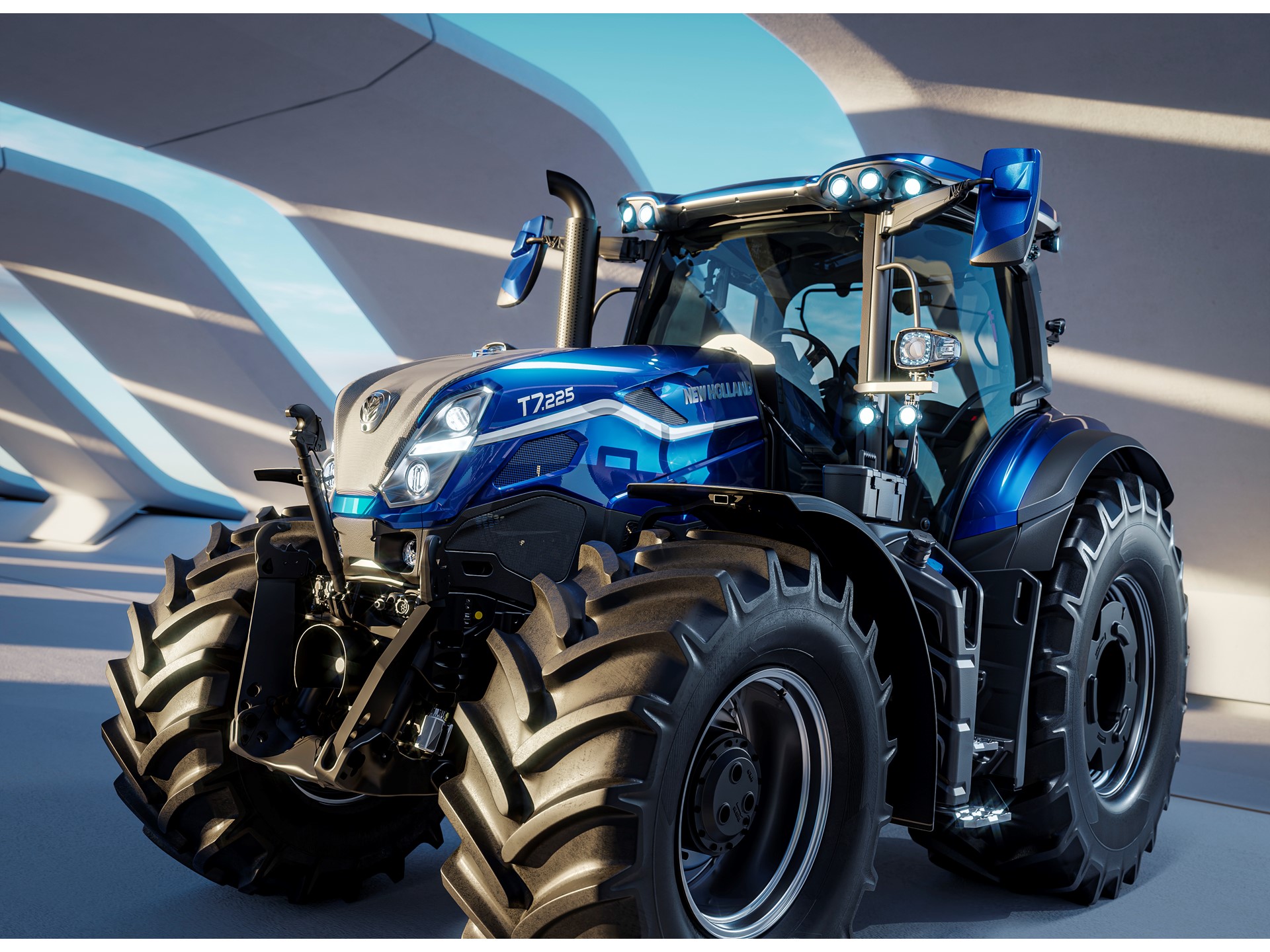 A modern blue New Holland T7.225 tractor with large rugged tires, sleek design, and multiple front and roof lights, parked indoors under a structure with curved beams casting shadows.