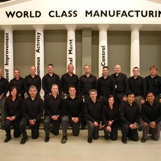 The WCM team, celebrate the award, alongside the Plant Manager