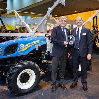 New Holland Agriculture executives accept the award