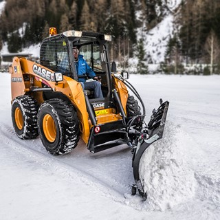 Case SR240 Skid Steer Loader equiped with a front mounted blade for clearing snow