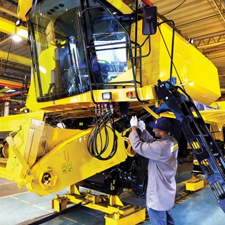 Production of a New Holland Agriculture combine harvester at CNH Industrial's Curitiba plant in Brazil
