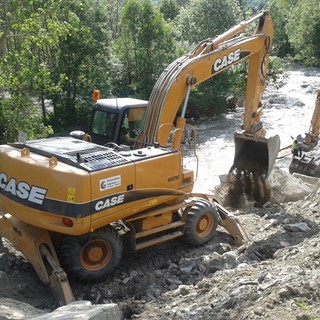 Case WX210 wheeled excavator repairing river banks in Europe following flooding