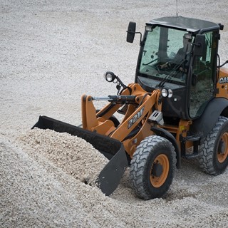 Case 221F Case compact wheel loader moving aggregate
