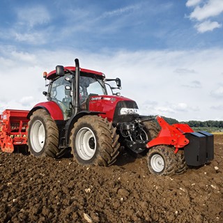 Maxxum 130 CVX working with front and rear mount equipment