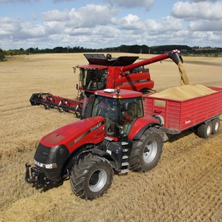 Axial Flow combine unloading into a Magnum
