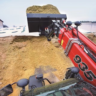 Farmlift loading silage in a bucket