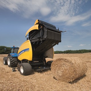 New Holland Roll Belt™ 180 SuperFeed™ ejecting a straw bale
