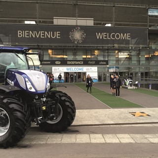 A New Holland Agriculture T7 tractor displayed outside COP 21 grounds