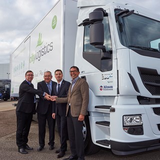 Representatives from Iveco and CityLogistics with the 1,000th natural gas vehicle sold by Iveco in France