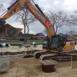 CASE CX300D Excavator at work in the new industrial area in Staphorst, in the North of Holland