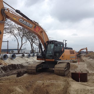 CASE CX300D Excavator at work in the new industrial area in Staphorst, in the North of Holland