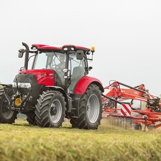 Case IH Maxxum Tractor with a windrower
