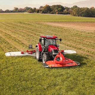Case IH Maxxum Multicontroller Tractor with a triple mower