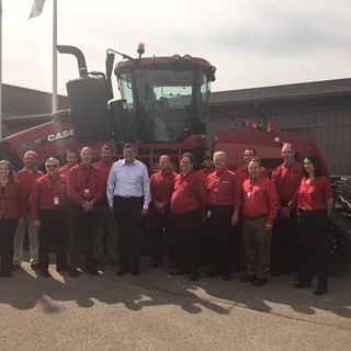Congressman Darin LaHood poses with CNH Industrial employees at Goodfiled, Illinois site