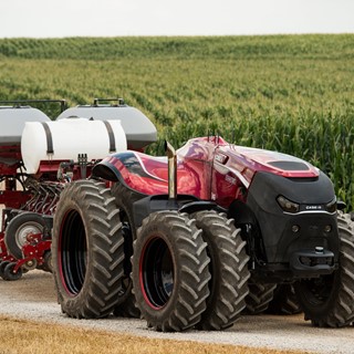 Case IH Magnum Autonomous Concept Tractor on the road with the Case IH Early Riser 2150 Planter in transport position