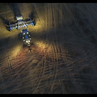New Holland T8 NHDrive Autonomous Concept Tractor in the field with the New Holland 2085 Air Disc Drill Working at Night