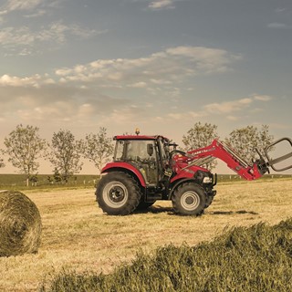 Case IH Farmall 95C. The ideal loader tractor moving bales
