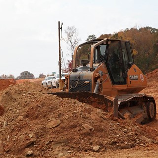 Site development earthmover finds right match of bulldozing size & power