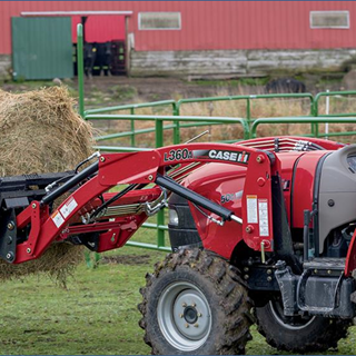 L360A Tractor Loader on a Farmall 50C moving bales