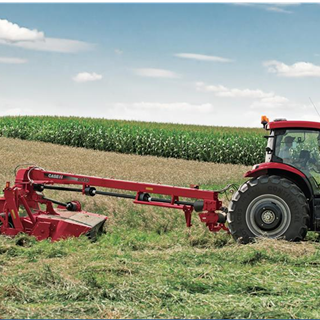Puma Tractor with a Disc Mower Conditioner at work