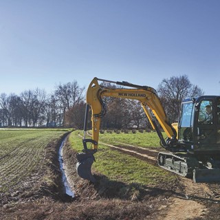 The latest New Holland Construction mini-excavator is perfect for on-farm ditching work