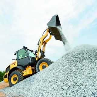 New Holland Construction Wheel Loader moving aggregate