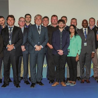 Carlo Lambro, New Holland Agriculture Brand President (center) with South African Dealers