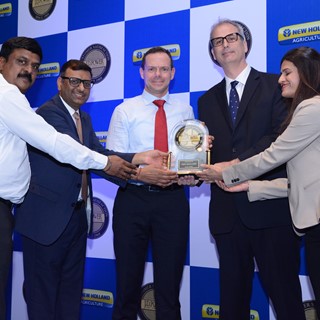 Senthil Kumar, Bimal Kumar and Gabriele Lucano receiving an award from J.D. Power Officials
