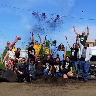 Victory Garden Initiative volunteers celebrate after installing 514 gardens